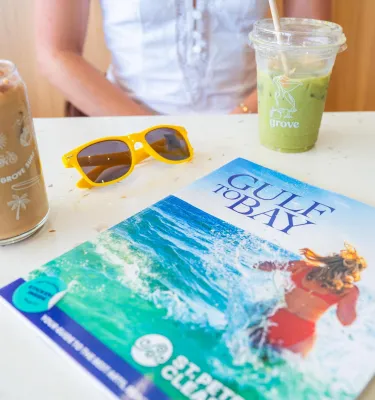 a Gulf to Bay magazine on a table in a coffee shop