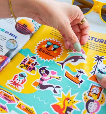 colorful stickers inside the 2026 Gulf to Bay magazine