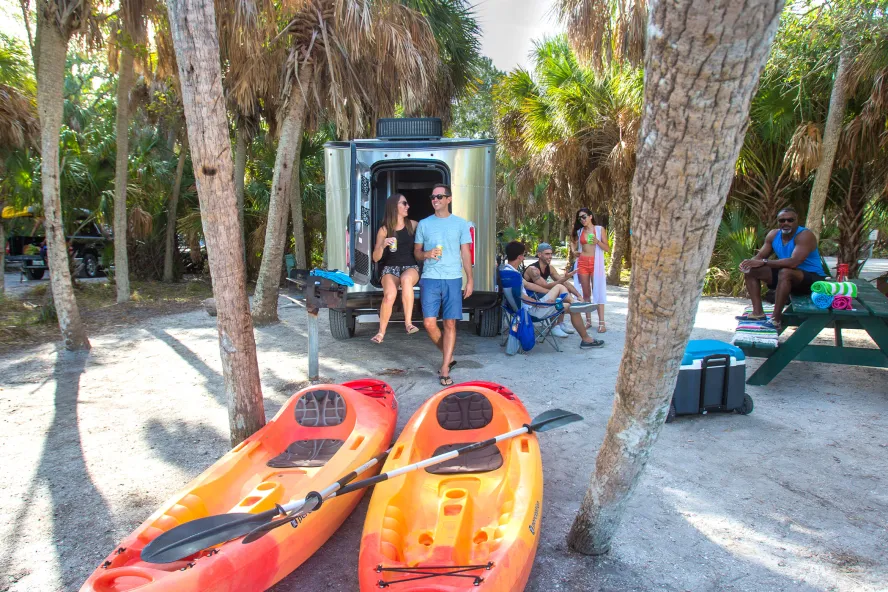 People camping in Fort de Soto Park with kayaks