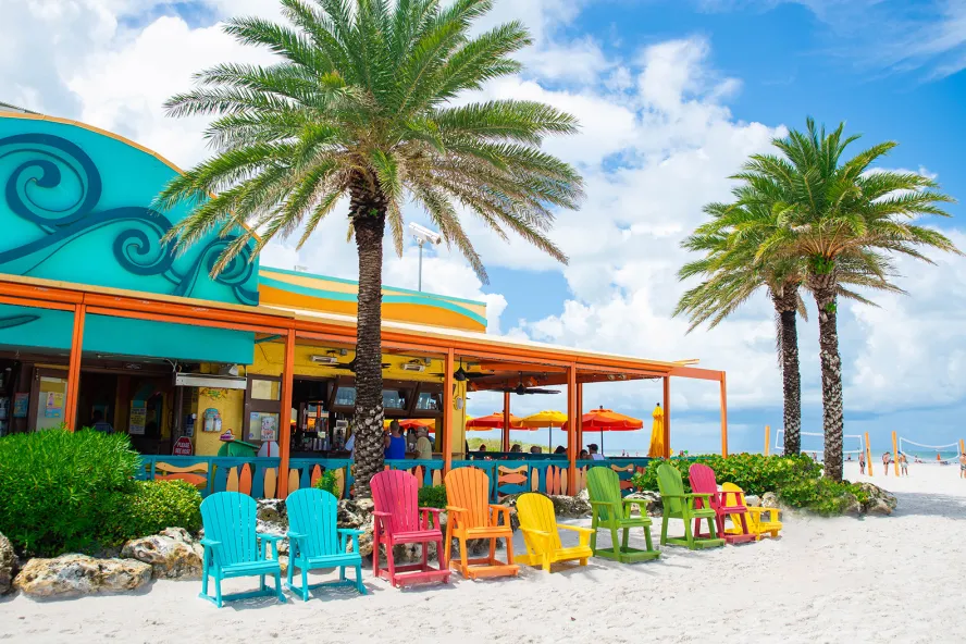 Colorful Adirondack chairs on the beach outside of Frenchy's Rockaway Grill
