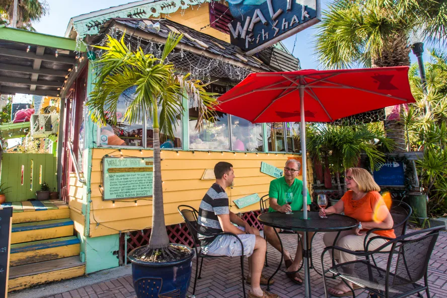 Family dining outside of Waltz Fish Shak in Madeira Beach