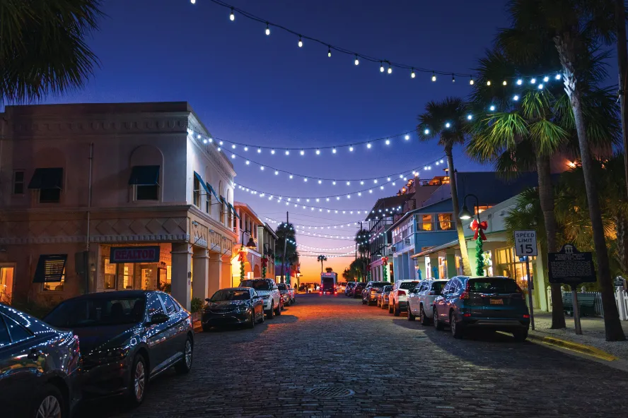Pass-a-Grille's small downtown area is lit up at dusk