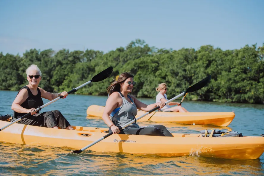 A group of women in yellow kayaks paddling around the St. Pete/Clearwater bay or Gulf of Mexico