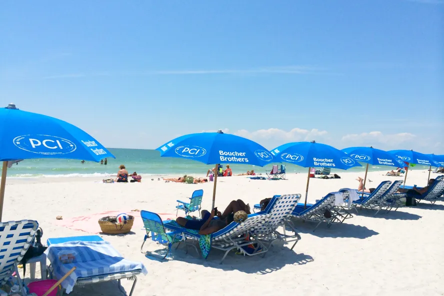 Blue chairs and umbrellas from Postcard Inn at St. Pete Beach