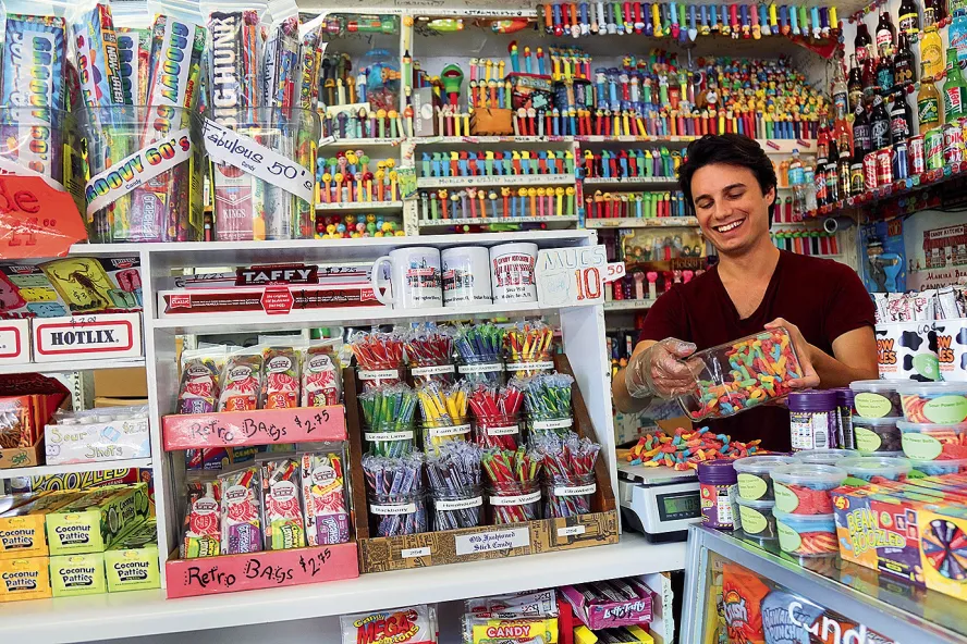 A employee behind a counter at the Candy Kitchen on Madeira Beach