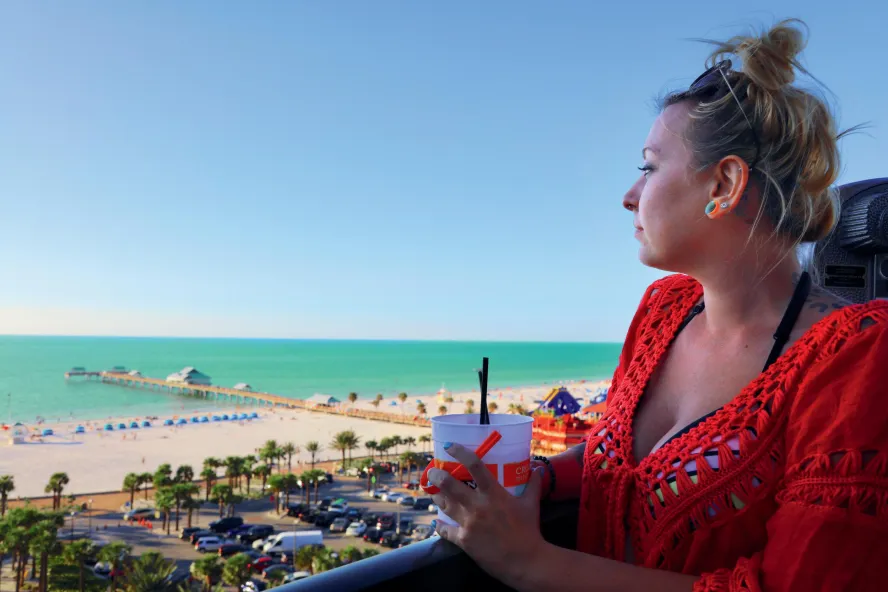 A woman looks out to the beach at Jimmy's Crow's Nest on Clearwater Beach