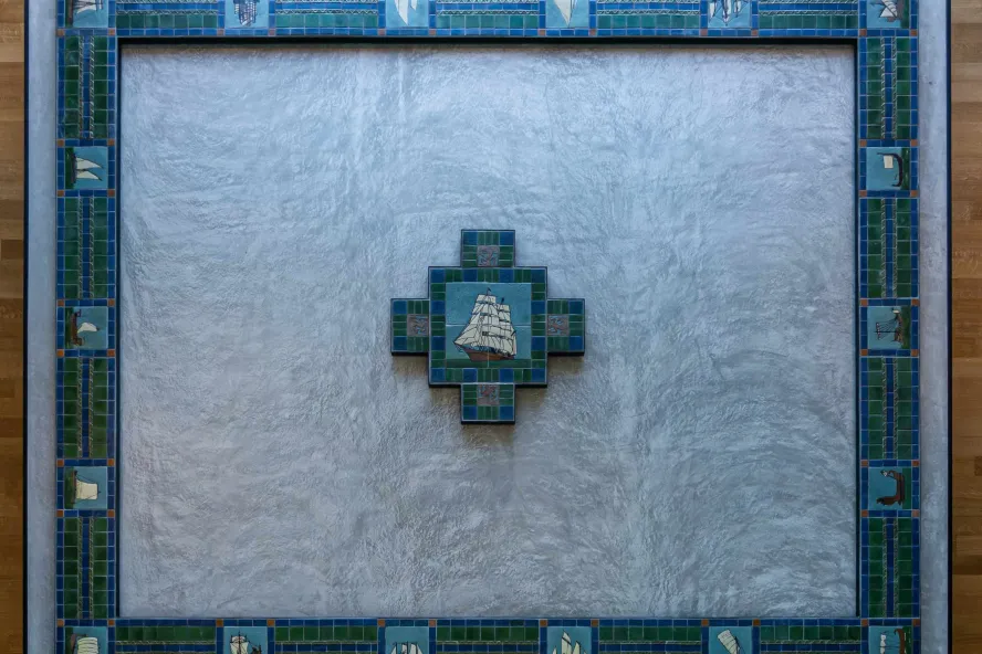 Handmade floor tiles From the turn of the 20th Century depicting a ship at sea.