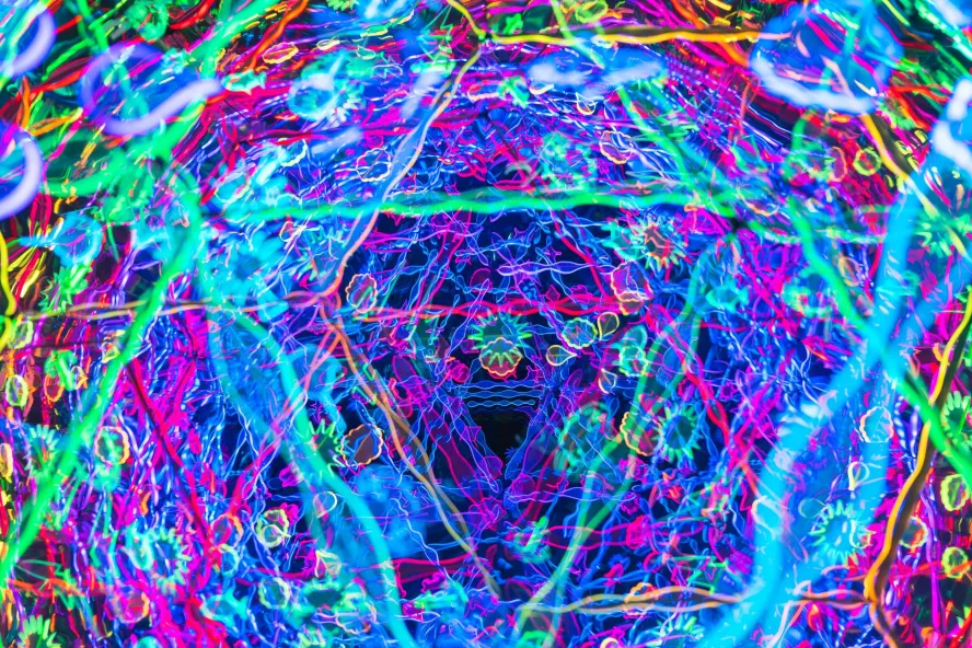 A neon blue red and purple kaleidoscope of colors at Fairgrounds St. Pete