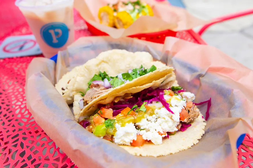 Pink basket of delicious tacos from Poppo's Taqueria Mexican restaurant in St. Pete.
