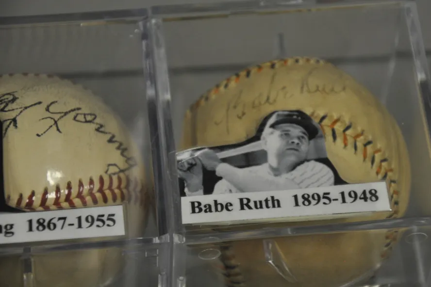 a glass case containing a baseball signed by Babe Ruth as well as his photo at the St. Petersburg Museum of History