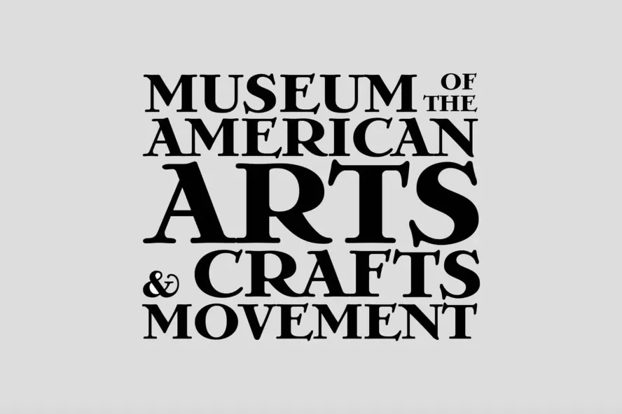 Museum of the American Arts & Crafts Movement signage featuring a grey background and black font.