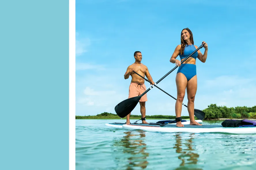 a light blue box next to a couple paddleboarding