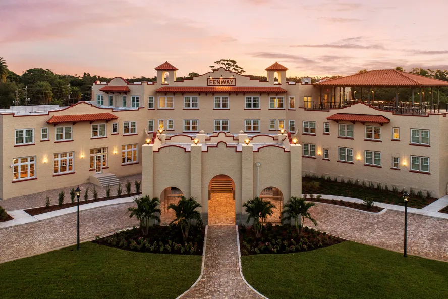 the exterior of the historic Fenway Hotel at dawn