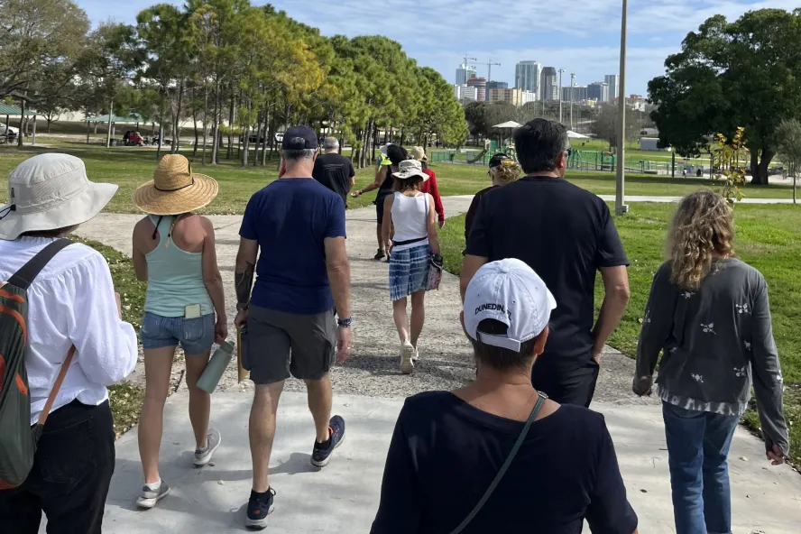 a small group of people on a walking tour