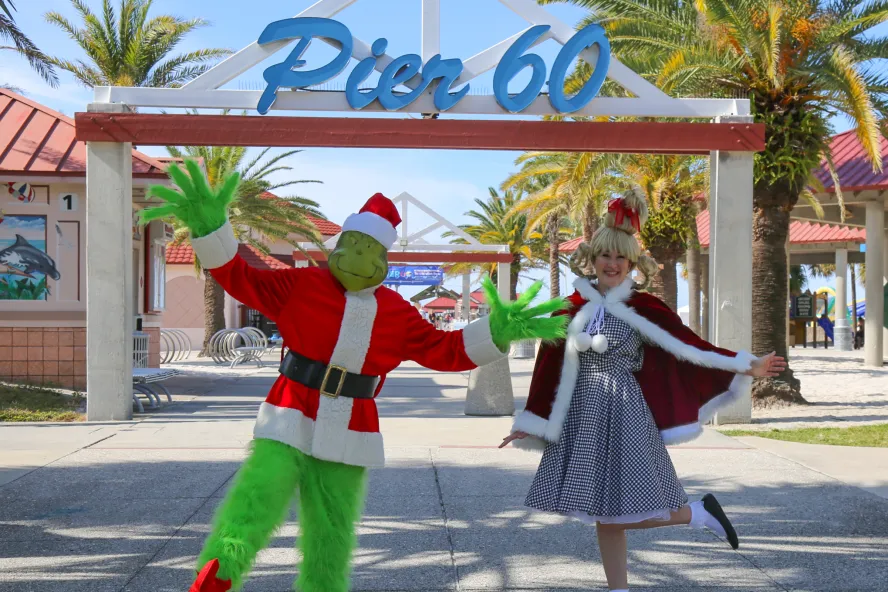 Grinch characters dressed up in front of Pier 60 in Clearwater.