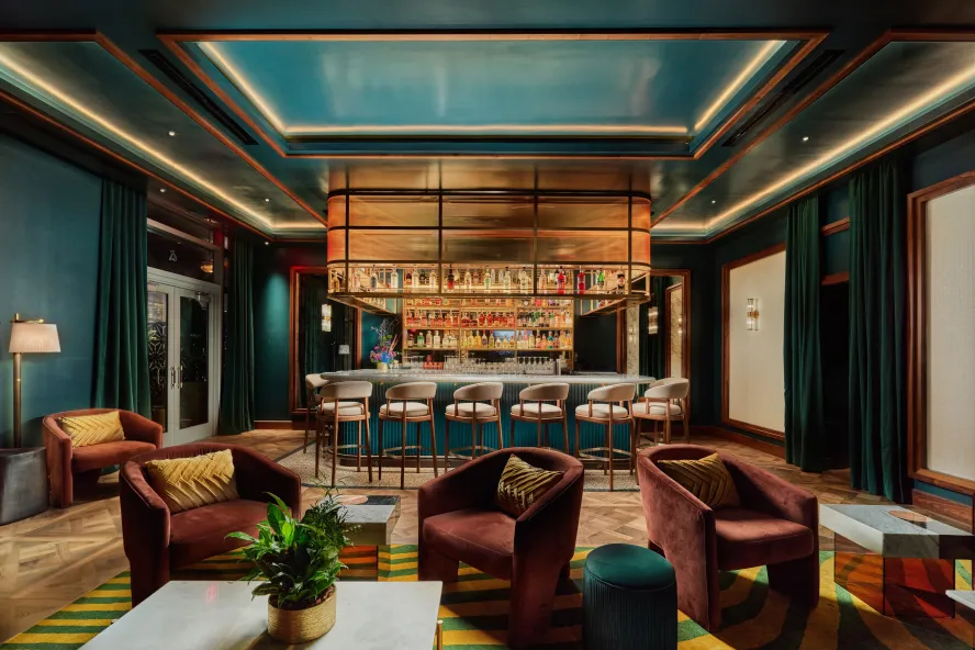 a stylish cocktail lounge decorated in rich jewel tones