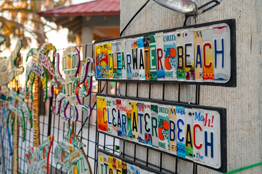 colorful artwork for sale that each say Clearwater Beach; the artwork is created from license plates