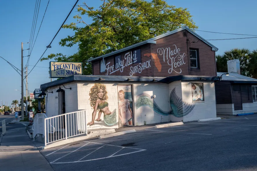 the exterior of the Freaky Tiki surf shop in St. Pete Beach with a mermaid painted on the side