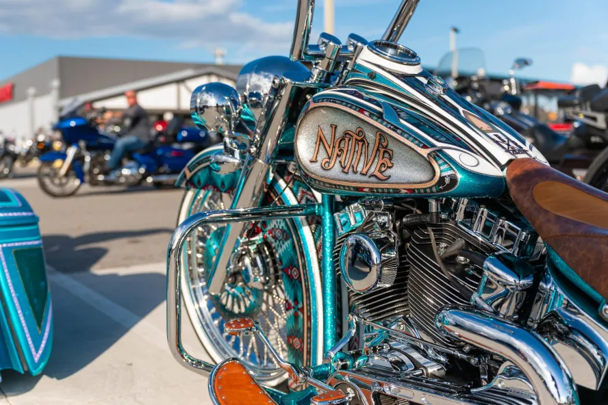 a close-up look at a green and blue motorcyle at St. Pete Bikefest