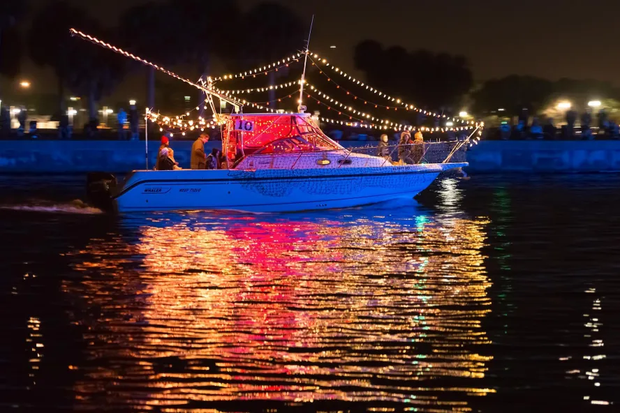 a boat lit up with holiday lights for the St. Pete holiday boat parade