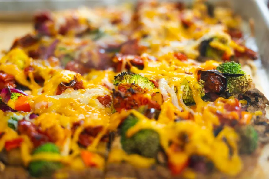 a close up of a square slice of pizza at Craft Kafe