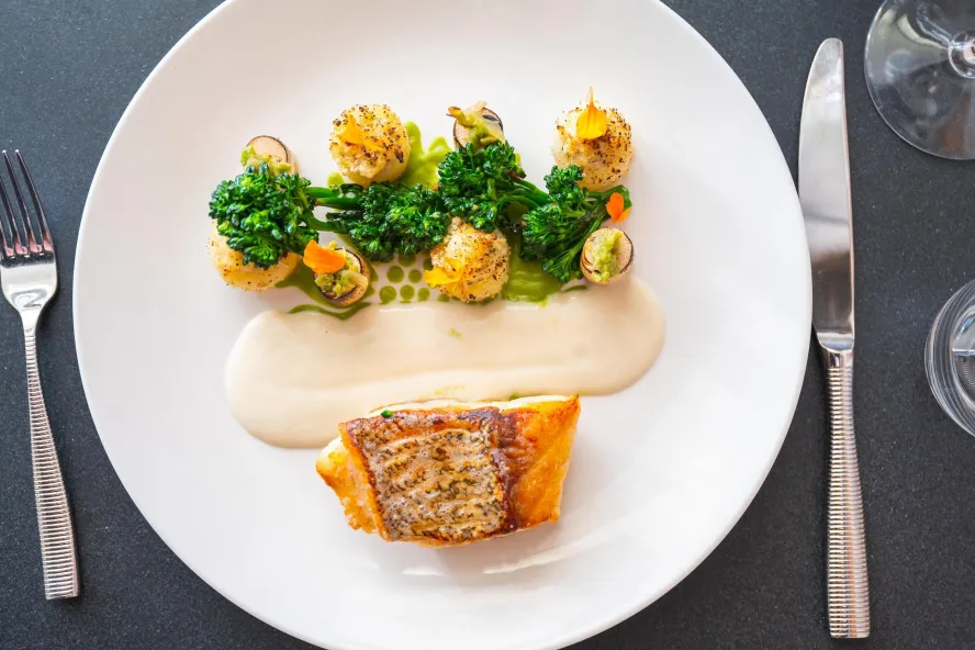 a beautifully design plate of fish and scallops created to look like a flowerpot at Il Ritorno
