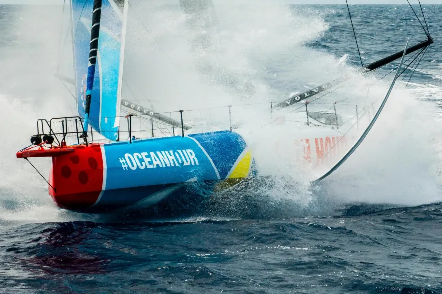 a sailboat splashes through the water during the Ocean Race, coming to St. Pete in May 2027