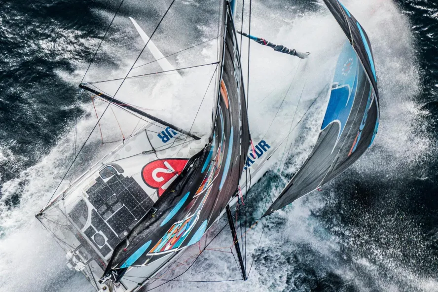 a thrilling overhead view of a sailboat in the Ocean Race, coming to St. Pete-Clearwater in May 2027