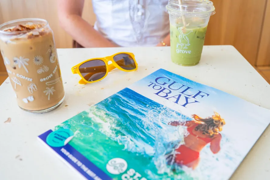 a Gulf to Bay magazine on a table in a coffee shop