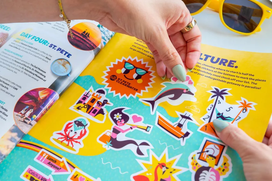 colorful stickers inside the 2026 Gulf to Bay magazine