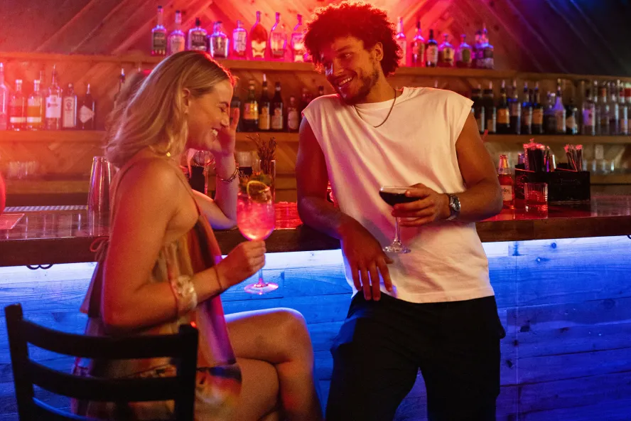 a young couple at a bar in downtown St. Pete