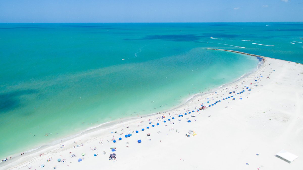 Aerial view of gorgeous white beaches and jewel-green water in Sand Key Park near Clearwater Beach