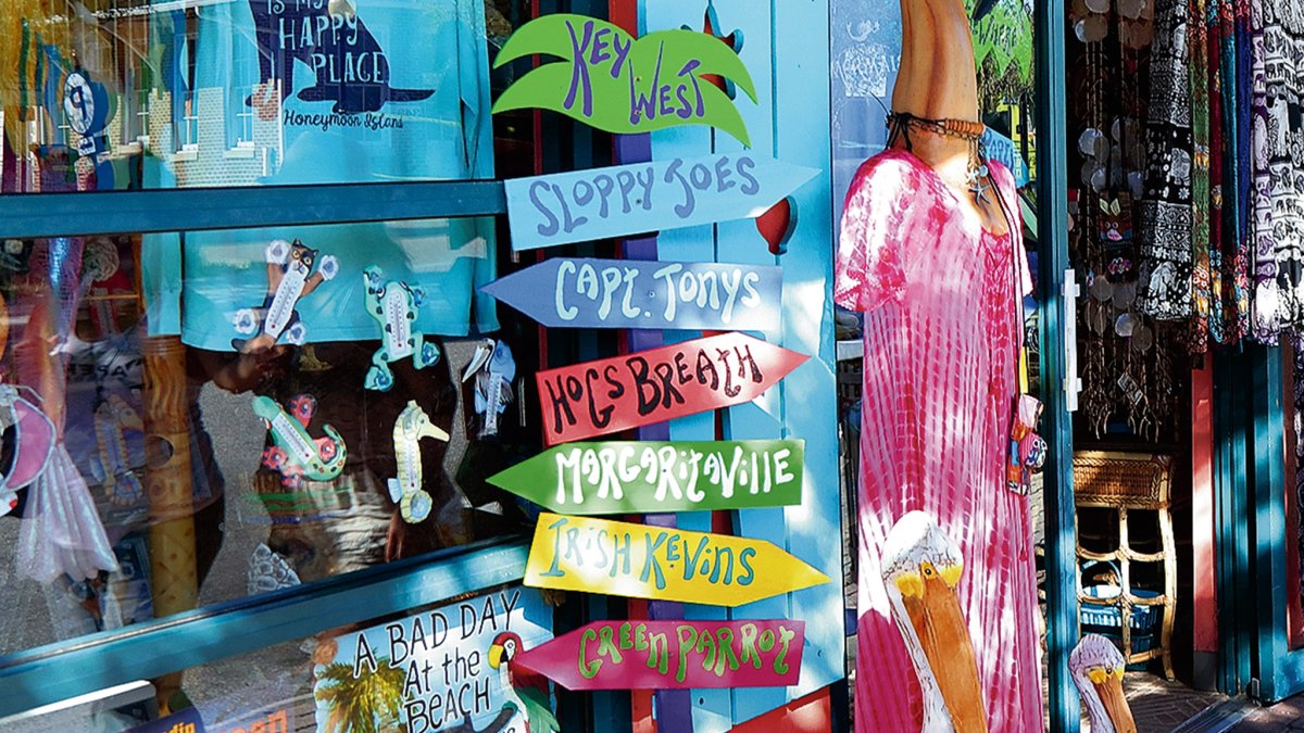 brightly signage decorates a shop window on Main Street in Dunedin, Florida