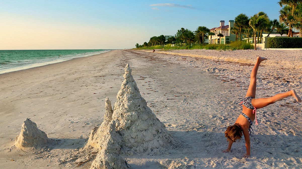 A girl playing in the sand in Belleair Beach.