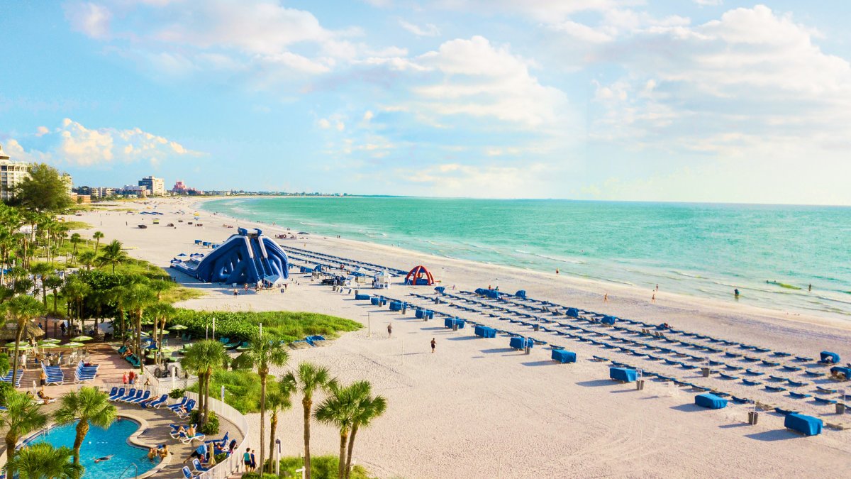 Pool, beach cabanas and a giant water slide at TradeWinds beachfront resort