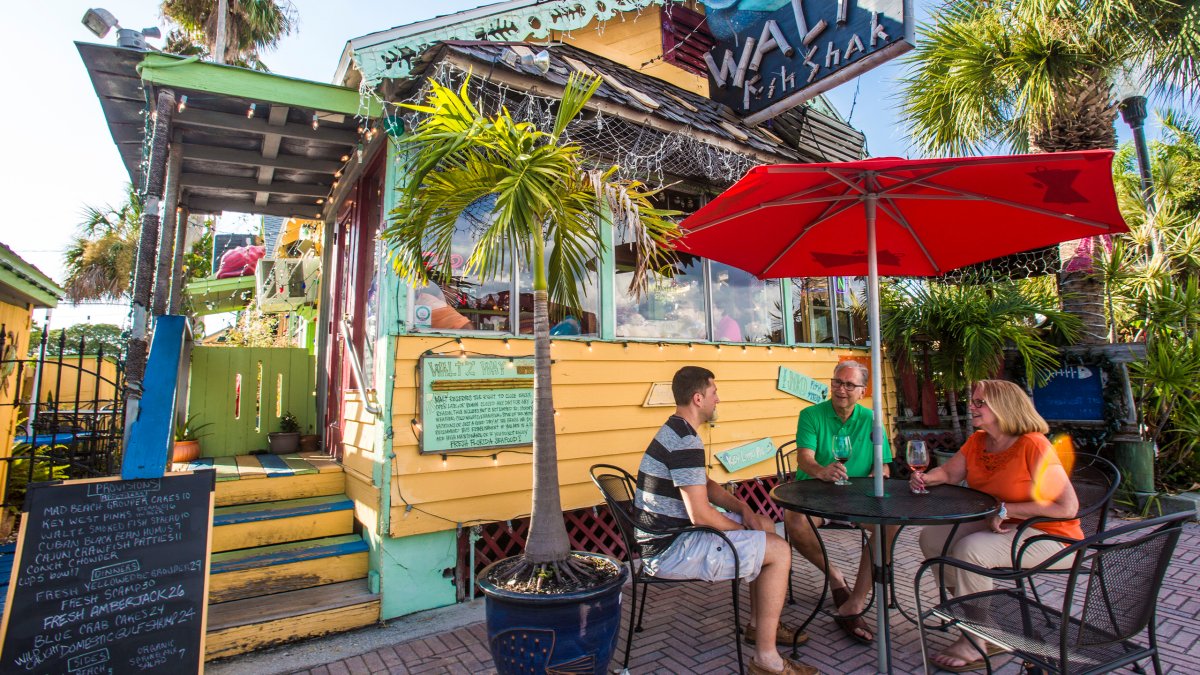 Family dining outside of Waltz Fish Shak in Madeira Beach