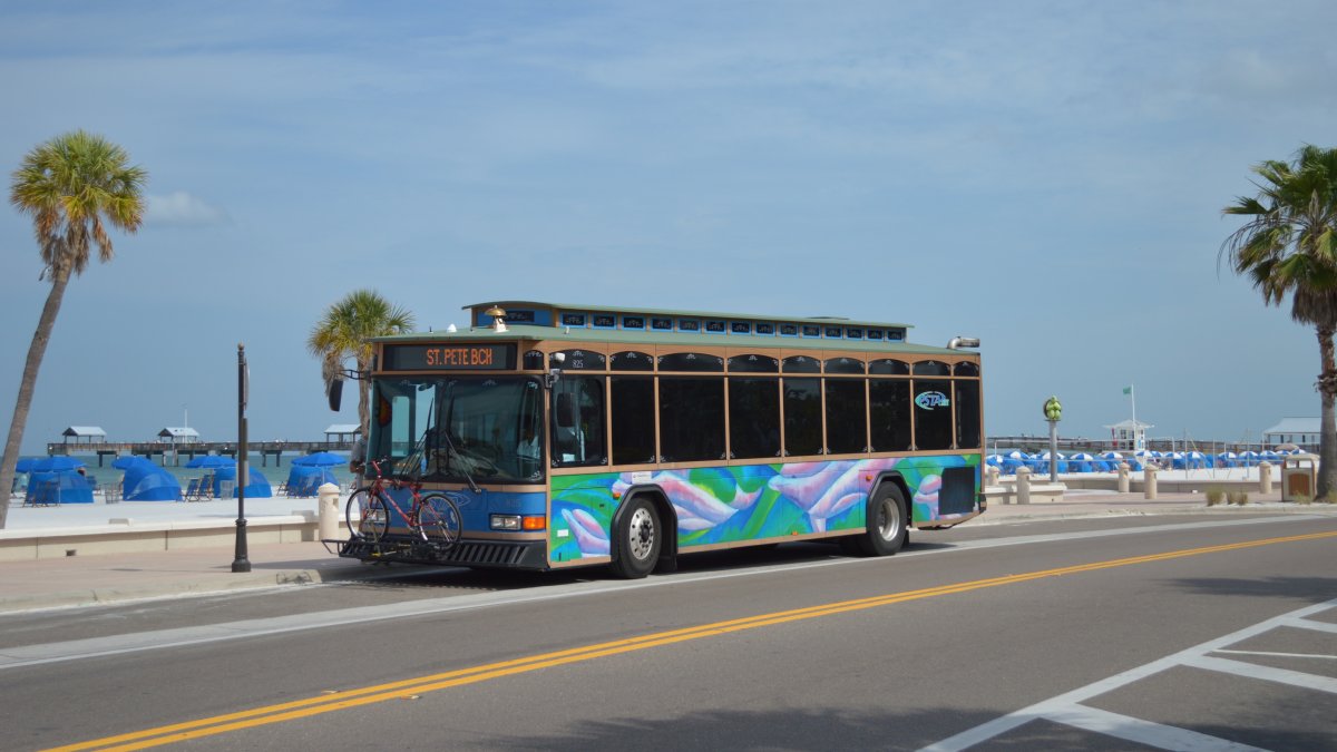 An image of the Suncoast Beach Trolley stopped in front of beach.