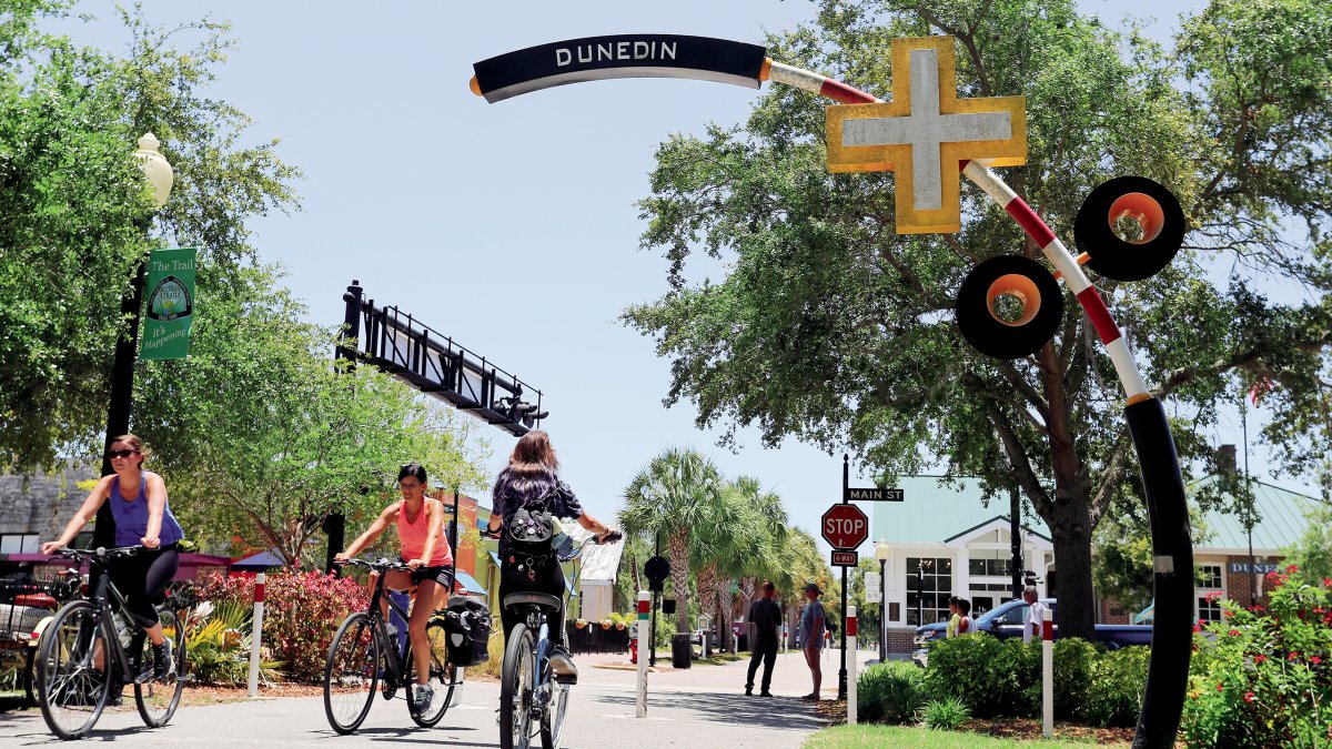 Bikers at Pinellas Trail crossing Dunedin's Main St.