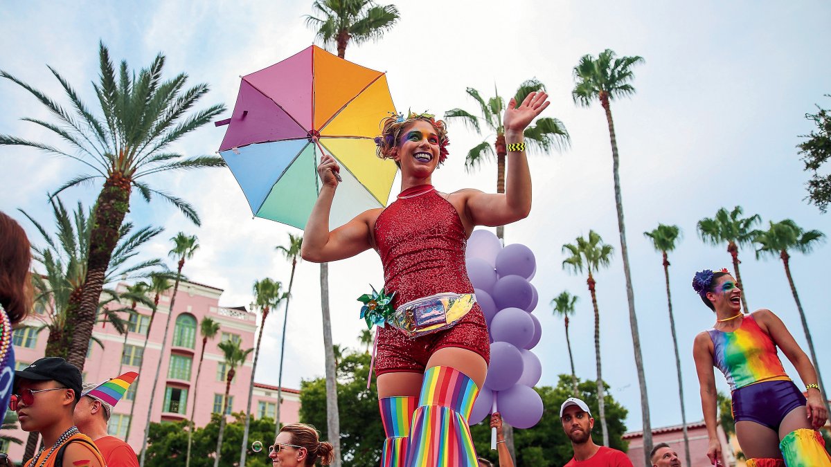 Marchers clad in rainbow clothing pass by the Vinoy during the St. Pete Pride Parade.