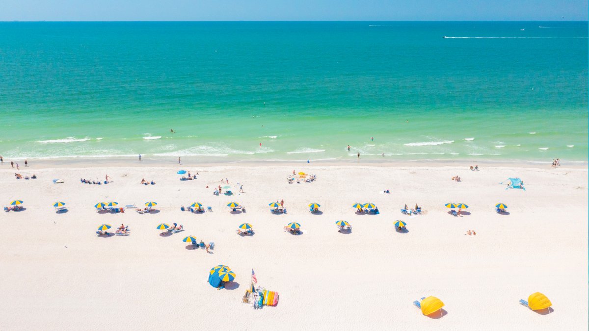 Treasure Island Beach aerial view of green waters and yellow cabanas