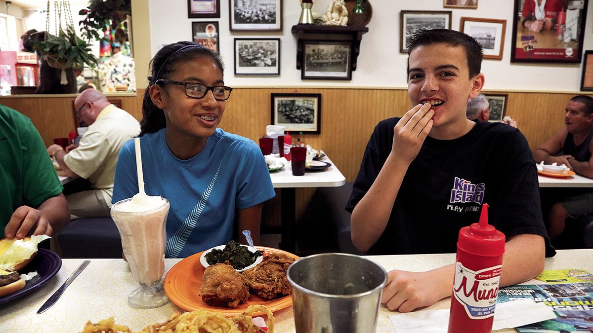 Two kids enjoy a meal at Munch's Restaurant