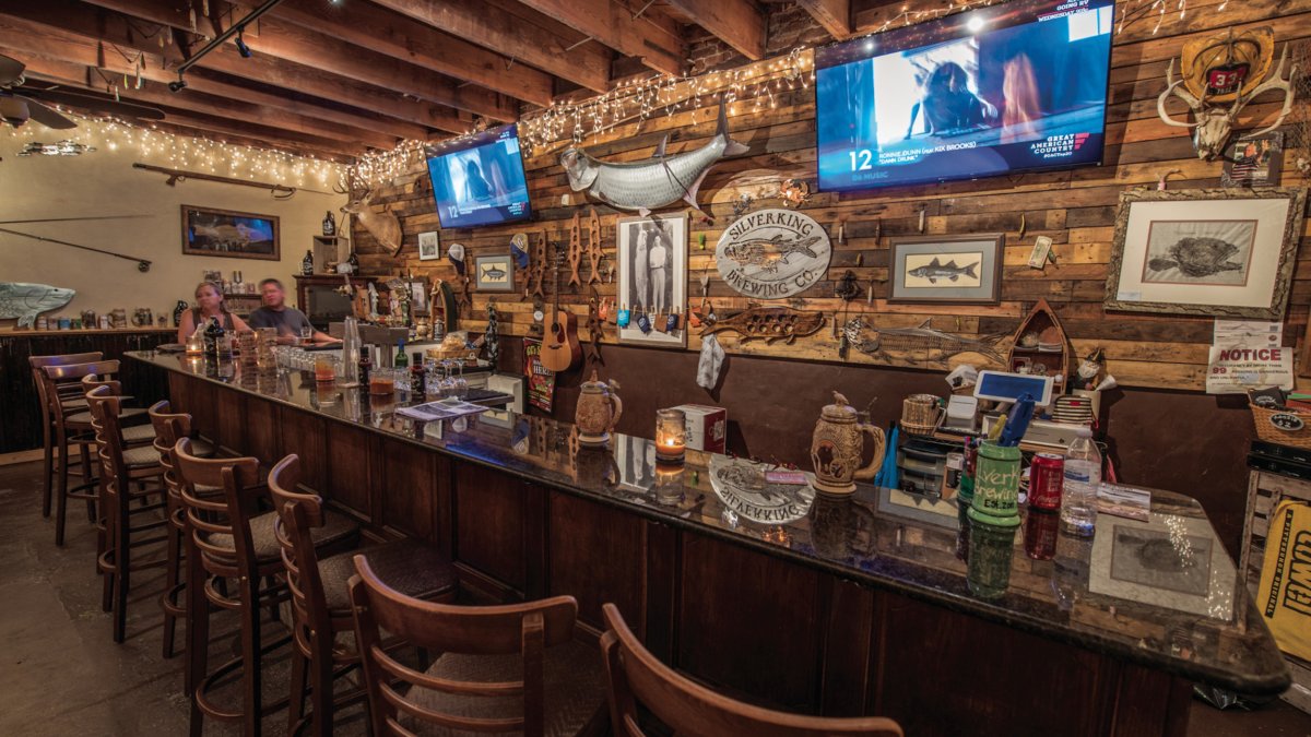 The interior of Silverking Brewing Co. showing bar decorated with marine life.