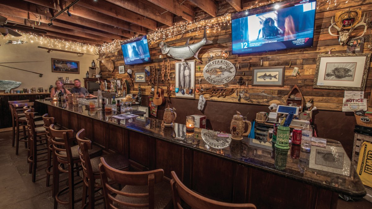 The interior of Silverking Brewing Co. showing bar decorated with marine life. 