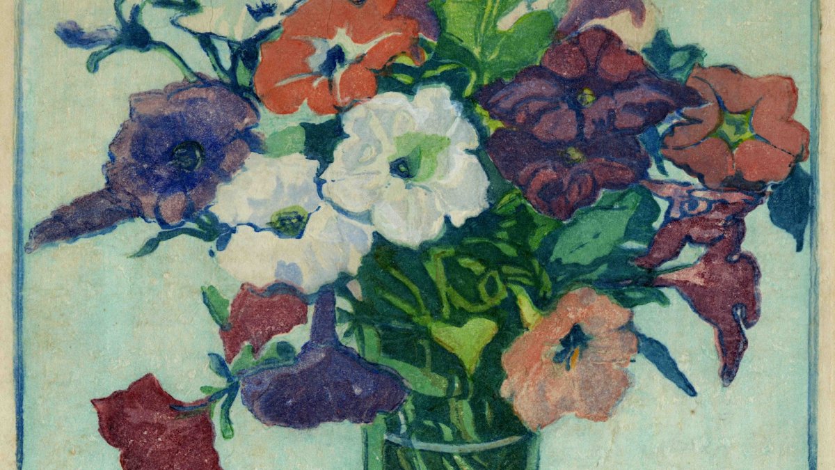 A wood block print featuring a vase full of purple, white, red and yellow petunias.