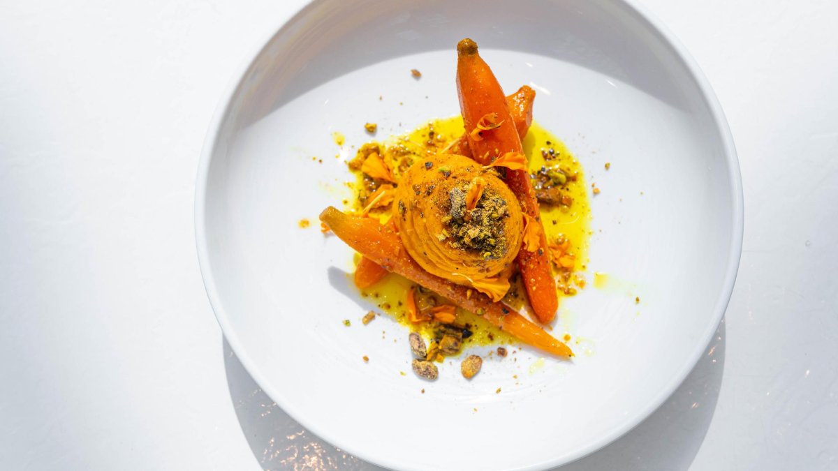 an artfully designed plate of food including carrots, spices and a sweet potato at Cafe Gala at the Dali Museum in St. Pete