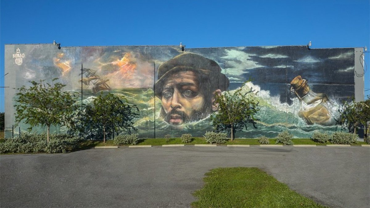 mural of Panfilo De Narvaez with sinking ship and bottle in the waves