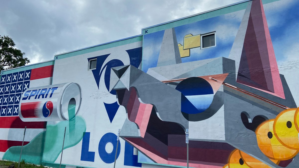 “Post Internet Explorers” mural by the Low Bros in the MLK North District featuring yellow emojis, a Pepsi Spirit can and the American flag colors.