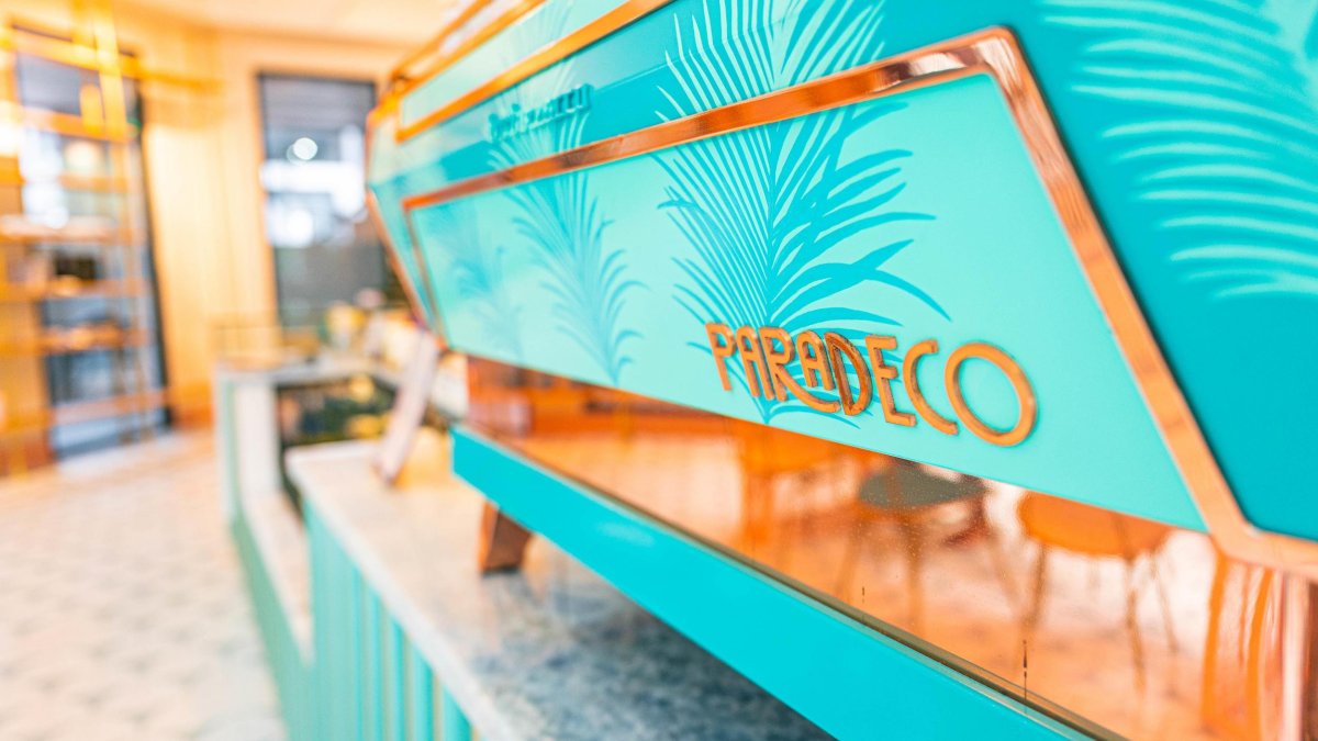 Paradeco Coffee Roasters turquoise counter detail with store name