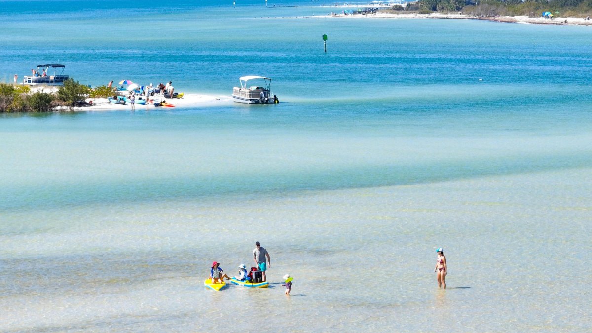 Swimmers, beach and boats at Caladesi and Honeymoon Island State Parks