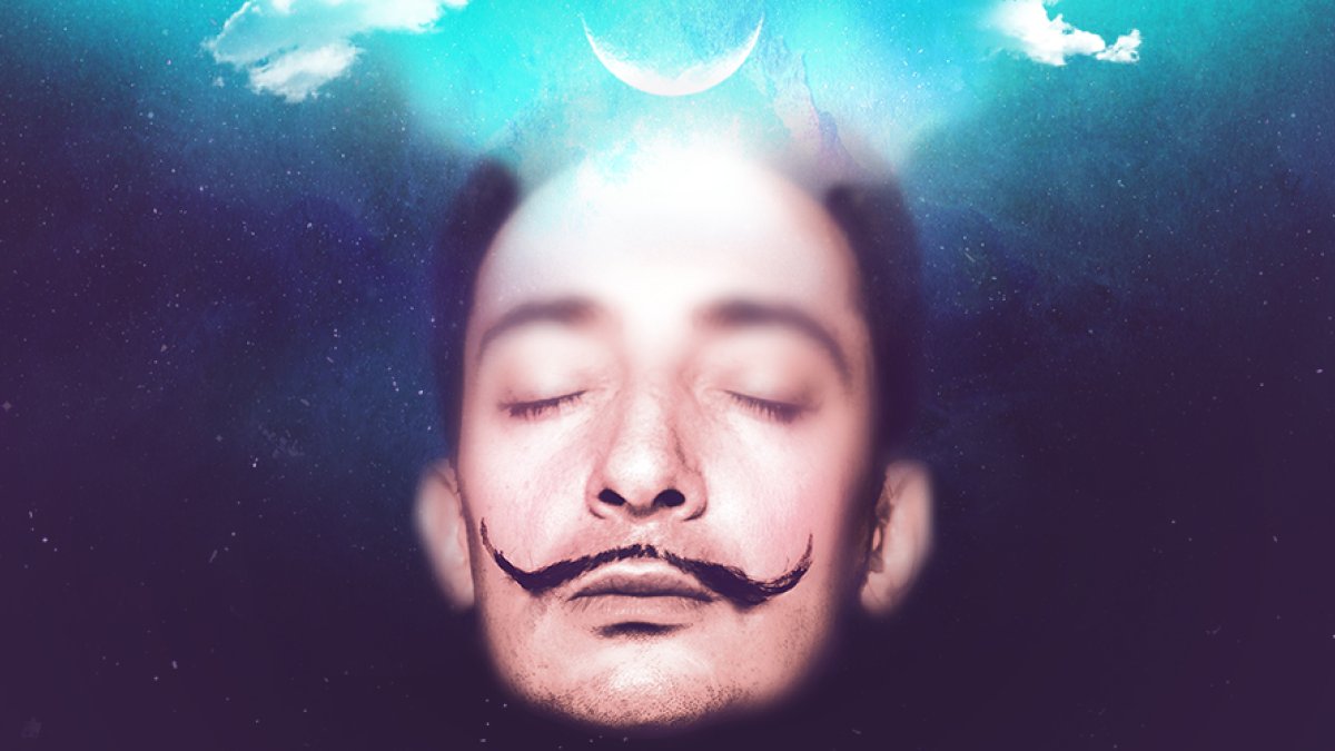 Photo of the head of famous artist Salvador Dalí with his eyes closed, in a dreamlike state featuring a dark blue background.